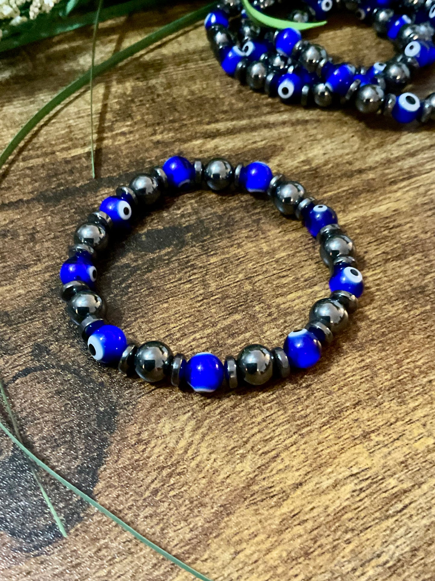 Evil Eye  & Hematite. 8 mm Lamp Glass Bracelet