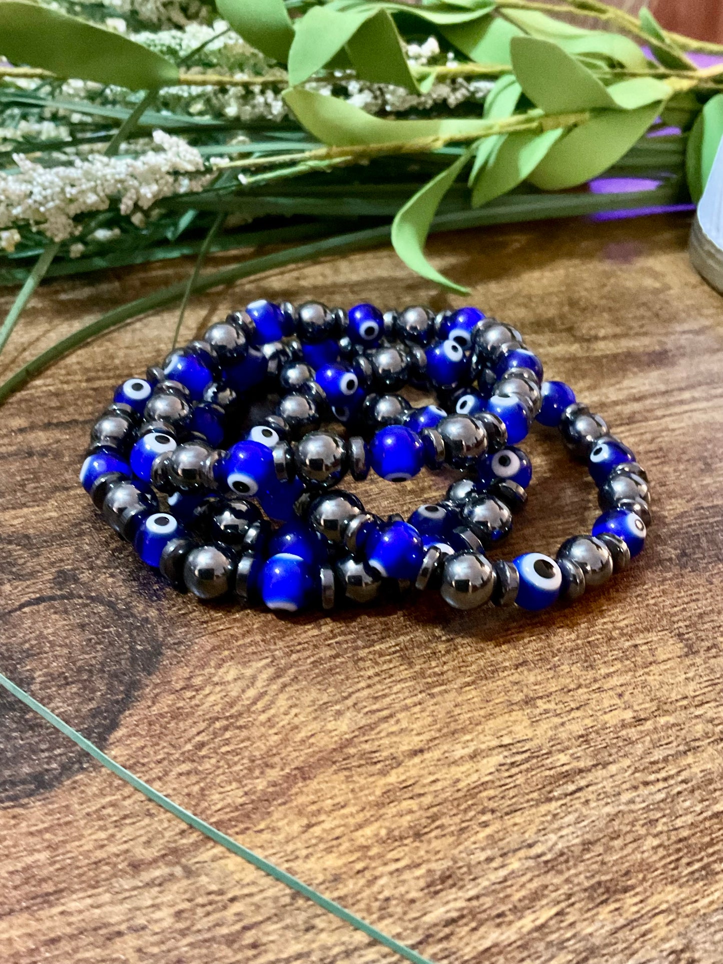 Evil Eye  & Hematite. 8 mm Lamp Glass Bracelet