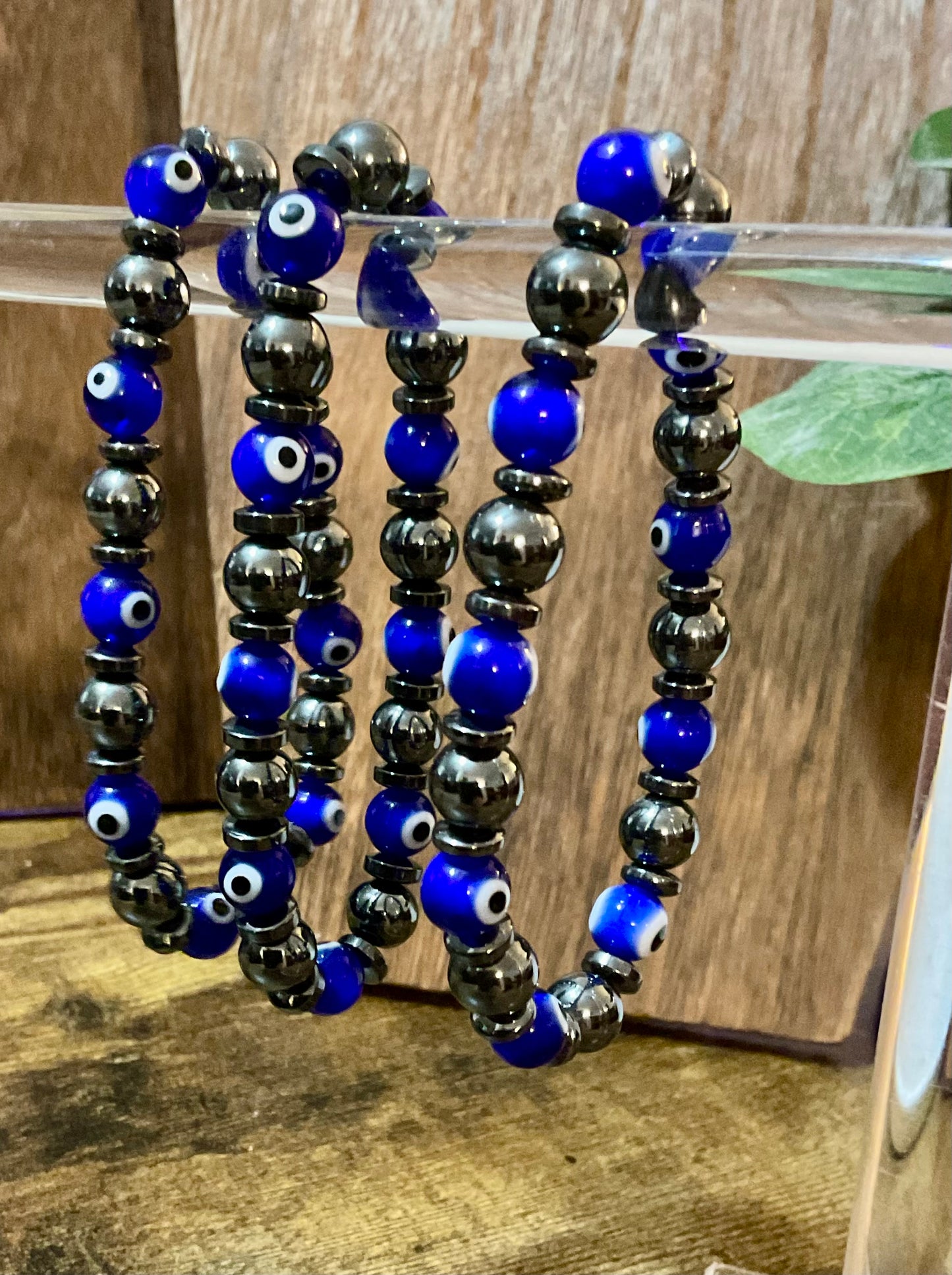 Evil Eye  & Hematite. 8 mm Lamp Glass Bracelet